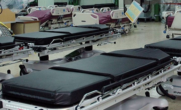 Stretchers lined up in a hospital ward